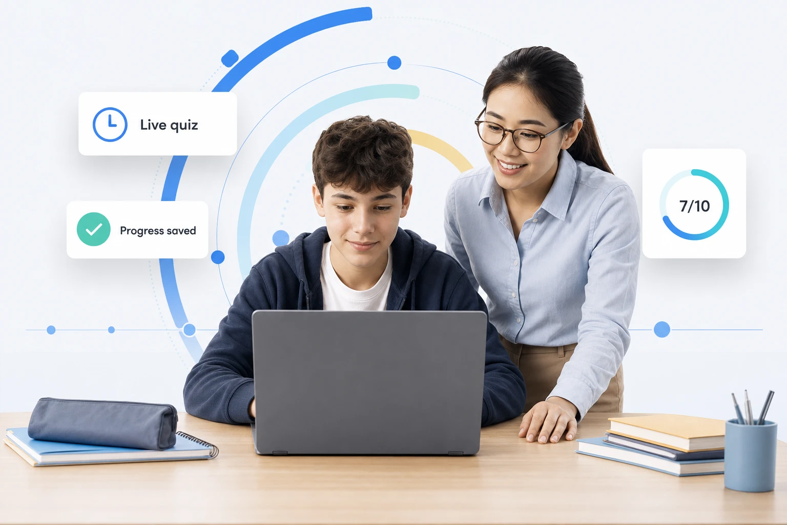 Teacher guiding a student through a live quiz on a laptop, with progress saved and a 7 out of 10 score shown